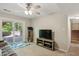 Living room with sliding glass doors and ceiling fan at 1649 Clairmont Ne Way, Brookhaven, GA 30329
