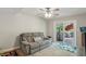 Cozy living area with a comfortable gray sofa and sliding glass doors leading to the deck at 1649 Clairmont Ne Way, Brookhaven, GA 30329