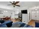 Open concept living room with wood floors and view to the kitchen and dining area at 1649 Clairmont Ne Way, Brookhaven, GA 30329