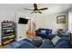 Comfortable living room features hardwood floors, a ceiling fan, and a cozy sectional sofa at 1649 Clairmont Ne Way, Brookhaven, GA 30329