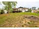 Expansive backyard featuring a deck and grassy area, perfect for outdoor activities and relaxation at 2619 Kellogg Creek Rd, Acworth, GA 30102