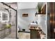 Modern bathroom features a walk-in shower with a glass door and a stylish vanity with a vessel sink at 2619 Kellogg Creek Rd, Acworth, GA 30102