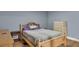 Cozy bedroom featuring wood-look flooring, light-blue walls, a bed, and dressers for ample storage at 2619 Kellogg Creek Rd, Acworth, GA 30102