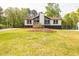 Charming home with well-manicured front yard and gated driveway at 2619 Kellogg Creek Rd, Acworth, GA 30102