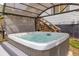 Relax in this large hot tub featuring a gazebo-style cover, perfect for enjoying year-round in the privacy of your own backyard at 2619 Kellogg Creek Rd, Acworth, GA 30102