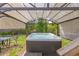 Relax in this large hot tub featuring a gazebo-style cover, perfect for enjoying year-round in the privacy of your own backyard at 2619 Kellogg Creek Rd, Acworth, GA 30102