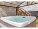 Relaxing hot tub with a covered patio, offering privacy and a serene outdoor experience at 2619 Kellogg Creek Rd, Acworth, GA 30102