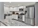 Kitchen with stainless steel appliances and a marble-topped island at 2619 Kellogg Creek Rd, Acworth, GA 30102