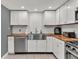 Kitchen featuring white cabinets, stainless steel appliances, and butcher block countertops at 2619 Kellogg Creek Rd, Acworth, GA 30102
