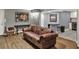 Living room with bar stool seating area and a leather couch at 2619 Kellogg Creek Rd, Acworth, GA 30102