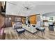 Open-concept living area featuring a wood accent wall, barn door, and vaulted ceilings at 2619 Kellogg Creek Rd, Acworth, GA 30102