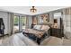 Spacious main bedroom with lots of natural light, walk in closet and modern ceiling fan at 2619 Kellogg Creek Rd, Acworth, GA 30102