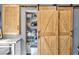 Walk in pantry with custom sliding barn door at 2619 Kellogg Creek Rd, Acworth, GA 30102