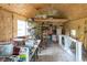Shed's interior features wooden walls and ceiling, with windows and storage space, suitable for DIY projects at 2619 Kellogg Creek Rd, Acworth, GA 30102