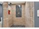 Walk-in shower with tile surround and updated fixtures at 2619 Kellogg Creek Rd, Acworth, GA 30102