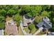 Aerial view of a property surrounded by lush green trees and manicured lawns at 2990 Byrons Green Ct, Marietta, GA 30062
