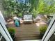 Outdoor deck with comfortable seating, perfect for relaxing and enjoying the natural surroundings at 2990 Byrons Green Ct, Marietta, GA 30062