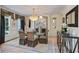 Sophisticated dining room with elegant chandelier, large windows, and stylish décor, perfect for entertaining at 2990 Byrons Green Ct, Marietta, GA 30062