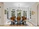 Elegant dining room with hardwood floors and large windows overlooking the backyard at 2990 Byrons Green Ct, Marietta, GA 30062