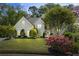 Beautiful two-story home with a manicured lawn, lush landscaping, and a welcoming front entrance at 2990 Byrons Green Ct, Marietta, GA 30062