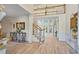 Grand foyer with soaring ceilings, hardwood floors, staircase, and an open view to the living area at 2990 Byrons Green Ct, Marietta, GA 30062