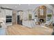 Spacious kitchen with island, stone fireplace, stainless steel appliances and hardwood floors at 2990 Byrons Green Ct, Marietta, GA 30062