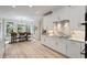 Bright, well-lit kitchen with stainless steel appliances and an adjacent dining area with large windows at 2990 Byrons Green Ct, Marietta, GA 30062