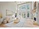 Bright and airy living room with high ceilings, large windows, fireplace, and stylish furnishings at 2990 Byrons Green Ct, Marietta, GA 30062