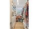 Walk-in closet with custom shelving and rod space for optimal organization and storage at 2990 Byrons Green Ct, Marietta, GA 30062