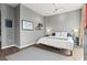 Cozy bedroom with hardwood floors, neutral paint, and comfortable furnishings with a serene atmosphere at 943 Peachtree Ne St # 2002, Atlanta, GA 30309