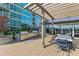 Outdoor grilling area with stainless steel grills and dining spaces creates a culinary hub at 943 Peachtree Ne St # 2002, Atlanta, GA 30309