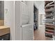 Efficient laundry room with stackable washer and dryer, built-in shelving for organized storage at 943 Peachtree Ne St # 2002, Atlanta, GA 30309