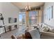 Bright living room featuring hardwood floors, modern decor, and expansive windows with city views at 943 Peachtree Ne St # 2002, Atlanta, GA 30309