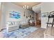 Inviting living room with a plush sofa, area rug, entertainment center, and modern decor at 943 Peachtree Ne St # 2002, Atlanta, GA 30309