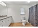 Bathroom with granite vanity, framed mirror, and shower-tub combo at 2009 Shipwreck Ct, Buford, GA 30518