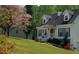 Charming home featuring a lovely front porch, beautiful landscaping, and inviting curb appeal at 2009 Shipwreck Ct, Buford, GA 30518