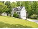 Charming two-story home with a convenient driveway and a lush green lawn at 2009 Shipwreck Ct, Buford, GA 30518