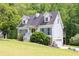 Two-story home with a well-manicured lawn and convenient driveway at 2009 Shipwreck Ct, Buford, GA 30518