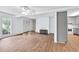 Bright living room with wood floors and easy kitchen access at 2009 Shipwreck Ct, Buford, GA 30518