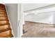 Open-concept living area with wood floors and staircase at 2009 Shipwreck Ct, Buford, GA 30518