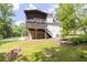 Charming screened porch overlooking the home's private wooded backyard and beautiful landscape at 2009 Shipwreck Ct, Buford, GA 30518