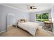 Bright bedroom with large window, study desk, and full-length mirror at 2102 Palmyra Se Dr, Marietta, GA 30067