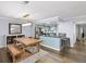 Dining area open to the modern kitchen, featuring hardwood floors and modern light fixture at 2102 Palmyra Se Dr, Marietta, GA 30067