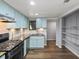 Well-lit kitchen with stainless steel appliances, granite countertops, and tile backsplash at 2102 Palmyra Se Dr, Marietta, GA 30067