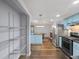 Open concept kitchen with stainless steel appliances and light blue cabinets at 2102 Palmyra Se Dr, Marietta, GA 30067