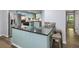 Modern kitchen with granite countertops, stainless steel appliances, breakfast bar, and hardwood floors at 2102 Palmyra Se Dr, Marietta, GA 30067