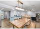 Open living area with hardwood floors, fireplace, and a kitchen with light blue cabinets at 2102 Palmyra Se Dr, Marietta, GA 30067