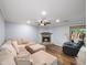 Cozy living room with hardwood floors, fireplace, and comfortable seating at 2102 Palmyra Se Dr, Marietta, GA 30067