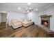 Spacious living room with hardwood floors, fireplace, and neutral walls at 2102 Palmyra Se Dr, Marietta, GA 30067