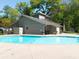 Community swimming pool featuring a large pool and a pool house with well-manicured landscaping at 2102 Palmyra Se Dr, Marietta, GA 30067